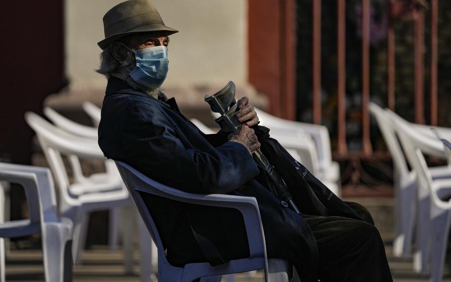 Luis Urrutia, an 84-year-old retired doctor, waits for his fourth COVID-19 vaccine shot, of AstraZeneca, at the start of a fourth shot booster shot campaign in Santiago, Chile, Monday, Jan. 10, 2022.