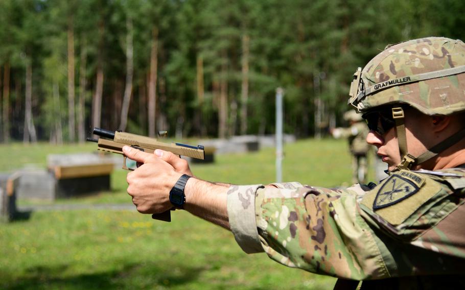 Sgt. Brent Grafmuller, from the 18th Military Police Brigade, fires an M17 pistol as part of the weapons qualification portion of the U.S. Army Europe and Africa Best Warrior competition in Grafenwoehr, Germany, Aug. 9, 2021. Grafmuller won the noncommissioned officer competition.