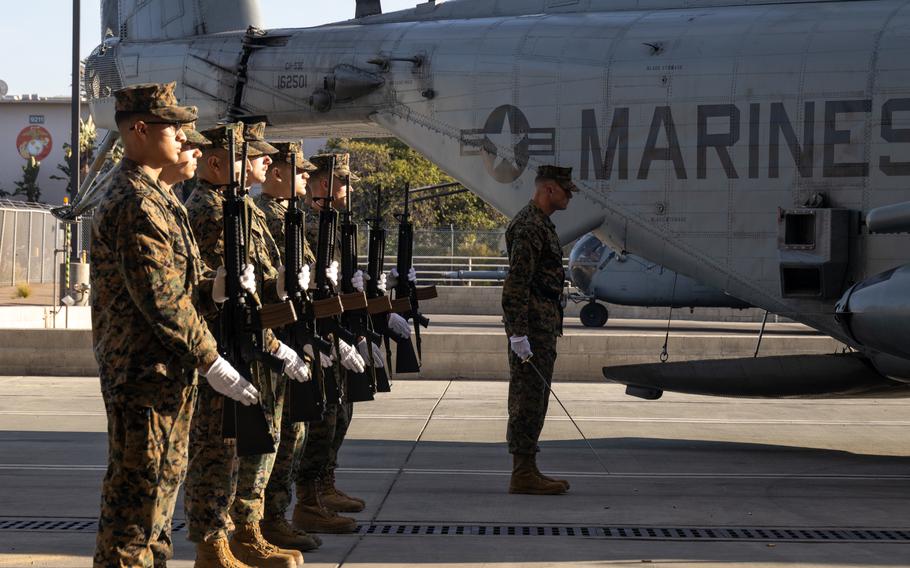 Marines with Marine Heavy Helicopter Squadron 361, Marine Aircraft Group 16, 3rd Marine Aircraft Wing present arms Feb. 16, 2024, following a 21-gun salute at Marine Corps Air Station Miramar, Calif., to honor five Marines who died in a recent helicopter crash. 
