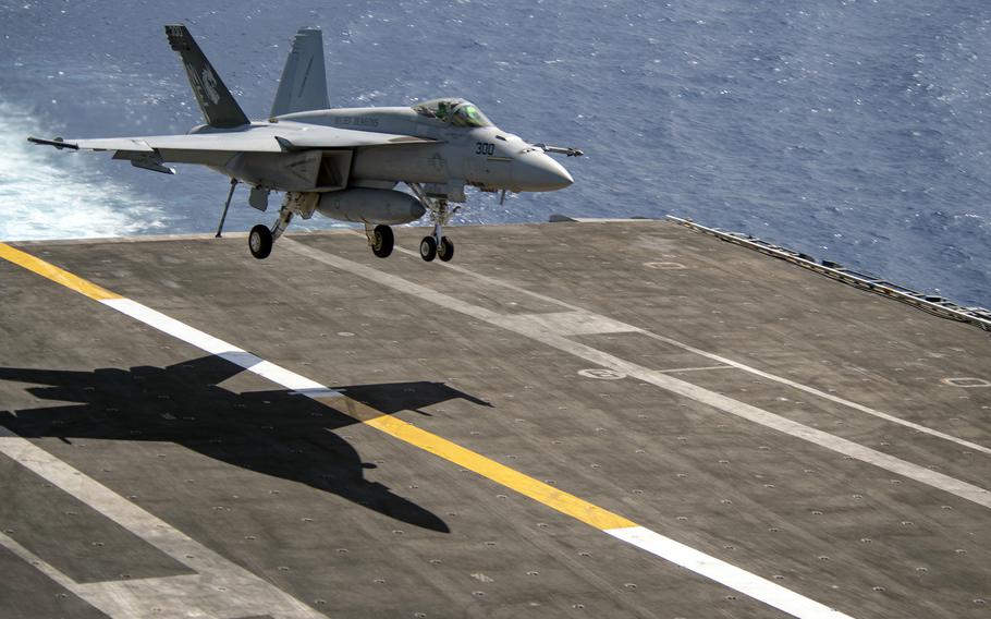 An F/A-18E Super Hornet lands on the flight deck of the aircraft carrier USS Carl Vinson in the South China Sea, Oct. 25, 2021.