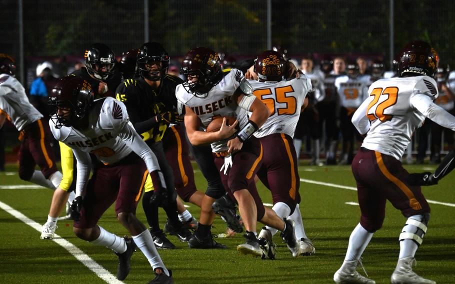 Vilseck senior RB Garrett Hyten rushes through a sea of Stuttgart defenders during the DODEA Europe Division I championship game against Stuttgart on Oct. 28, 2023, at Stuttgart High School. Hyten was crucial to keeping the Falcons in the game with two rushing touchdowns.