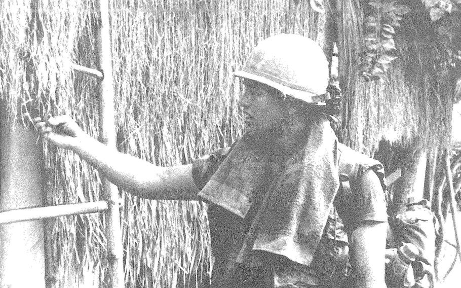 An American soldier sets fire to a Vietnamese home during the My Lai Massacre, March 16, 1968.