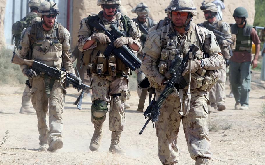 Soldiers from November Company, 3rd Battalion, Royal Canadian Regiment, patrol a village in Afghanistan's Kandahar province in September 2008. Maj. Gen. Wayne Eyre, acting head of Canadian forces, wrote a public letter acknowledging questions about the legacy of their time in Afghanistan, after the Taliban took control of Panjwai district in southern Kandahar province, where many Canadians fought and died.