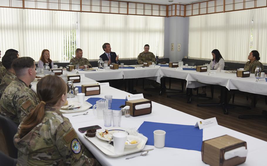 Virginia Gov. Glenn Youngkin chats with service members over breakfast at the Samurai Cafe on Yokota Air Base, Japan, Wednesday, April 26, 2023.