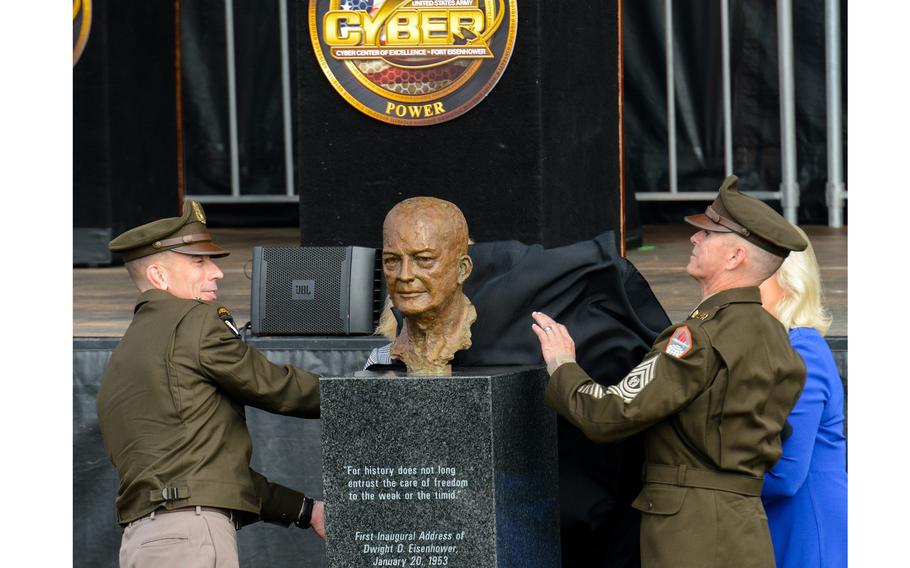 Army Maj. Gen. Paul Stanton, the commander of Fort Eisenhower and the Army Cyber Center of Excellence, right, and Command Sgt. Maj. Michael Starrett unveil a bust of General of the Army and President Dwight D. Eisenhower during a renaming ceremony Friday, Oct. 27, 2023. The former Fort Gordon, Ga., was the last of nine Army bases to be renamed this year to drop their former names honoring Confederate generals.