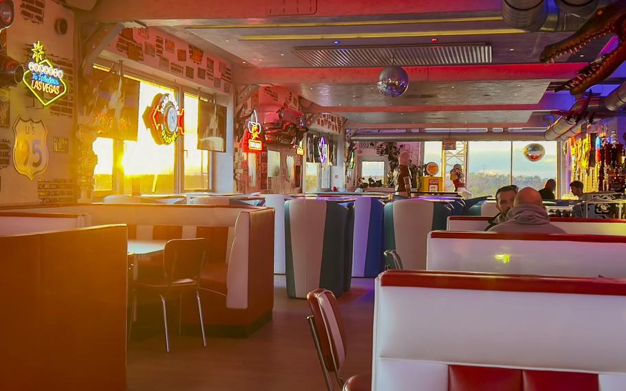 As evening descends in Ruesselsheim, Germany, Freeway Restaurant's booths are bathed in a welcoming glow Nov. 7, 2023. The diner's lighting and ambience create a cozy haven.