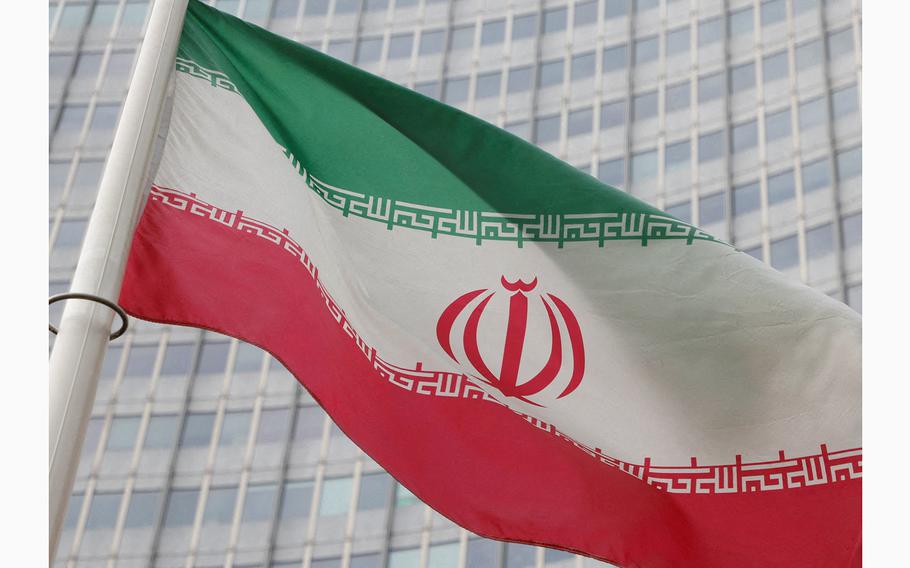 The Iranian flag flutters outside the International Atomic Energy Agency