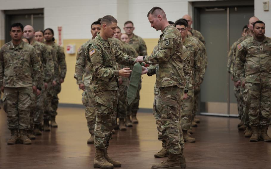 Washington National Guard soldiers with the 506th Military Police Detachment, 420th Chemical Battalion, 96th Troop Command, case the unit colors during a ceremony on Joint Base Lewis-McChord, Wash., Oct. 29, 2023. The detachment is deploying to Jordon in support of Operation Spartan Shield.