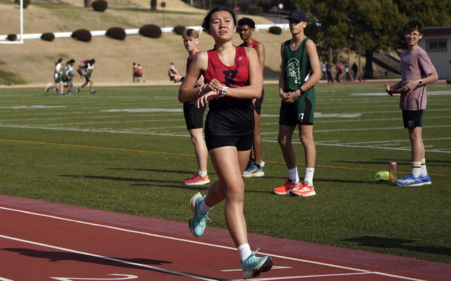 Nile C. Kinnick's Mia Bartram crosses the finish line victorious in the 3,200 during Saturday's Japan track and field meet at Zama.