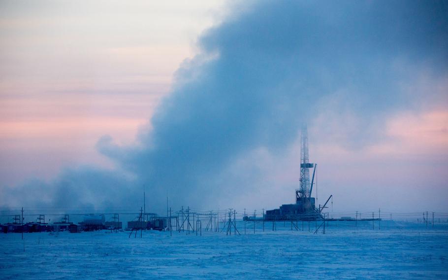 An oil derrick stands near the Russkoye heavy crude oil field, operated by Rosneft in the Yamalo-Nenets region of East Siberia, near Novy Urengoy, in Russia, on Dec. 8, 2016.