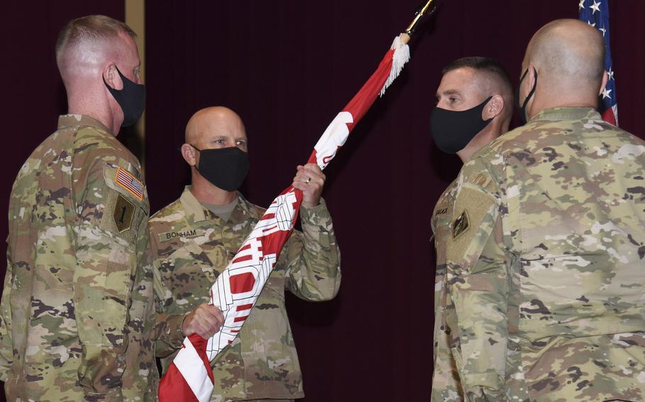 Col. Gary Bonham, holding the guidon, takes command of the Army Corps of Engineers, Japan Engineer District, from Col. Thomas Verell at Camp Zama, Japan, Tuesday, July 20, 2021. 