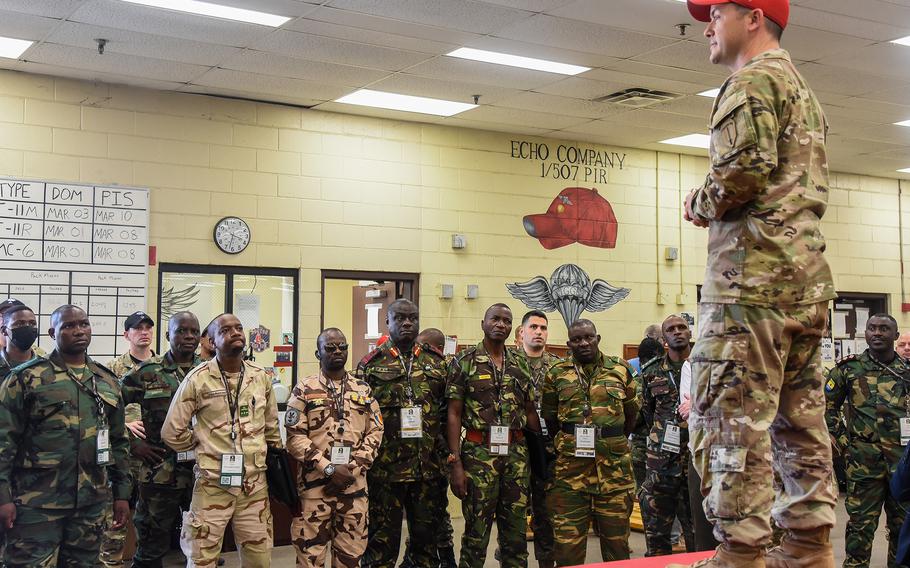 U.S Army Chief Warrant Officer 2 Wade Head, an airdrop systems technician with Fort Benning’s 1st Battalion, 507th Parachute Infantry Regiment, explains parachute rigging to African military leaders during the U.S. Army’s African Land Forces Summit March 22, 2022, at Fort Benning, Ga. Head’s unit is part of the Army’s Airborne School.