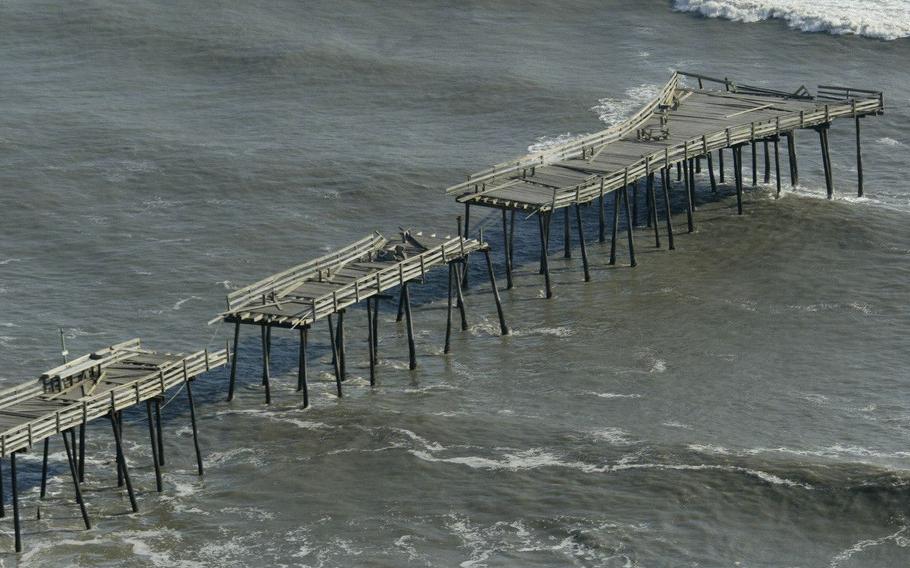 A pier damaged by Hurricane Isabel is shown in Kitty Hawk, N.C., Sept. 19, 2003. The storm has left 13 dead and 4.5 million homes and businesses without power from the Carolinas to New York.