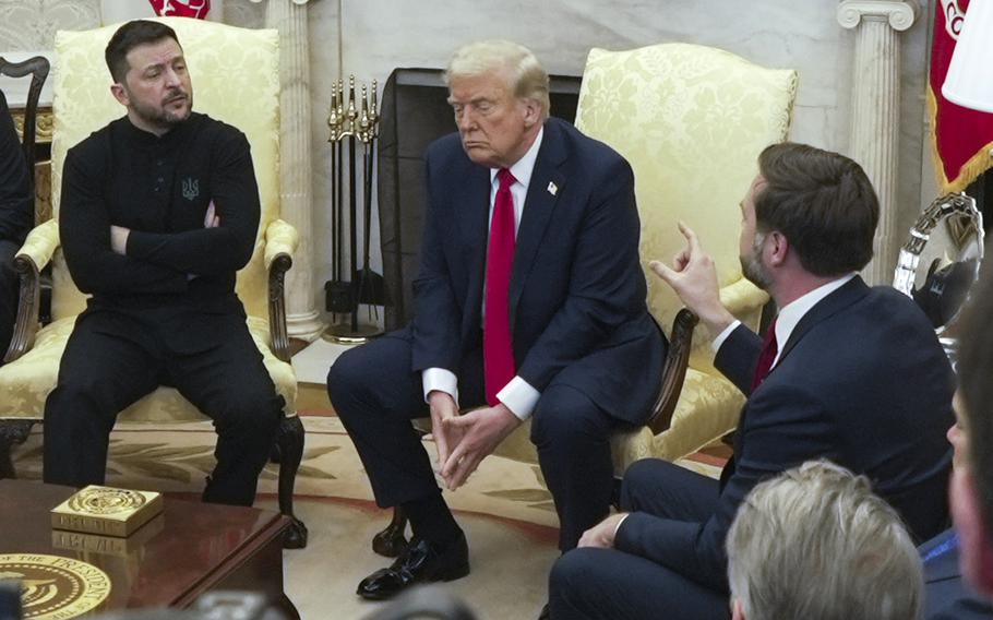 Volodymyr Zelenskyy, Donald Trump and JD Vance sit next to each other in front of a fireplace in the Oval Office of the White House.