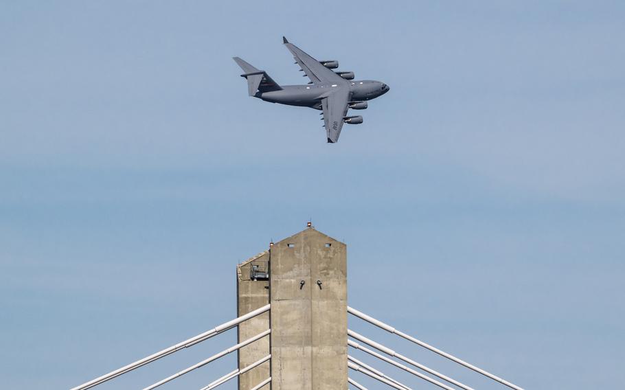 A U.S. Air Force C-17 Globemaster III from the 97th Airlift Wing at Altus Air Force Base, Okla., performs an aerobatic display during the Thunder Over Louisville air show in Louisville, Ky., Saturday, April 20, 2024.
