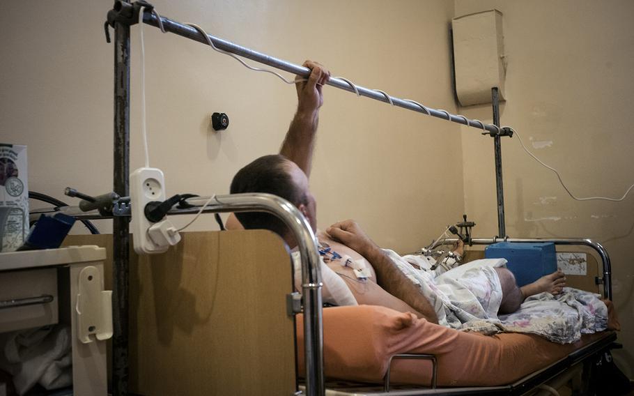 A Ukrainian soldier wounded during early fighting in the new offensive in the Kherson region is cared for at a medical facility in southern Ukraine. Ukrainian forces are pushing to retake territory occupied by Russia. 