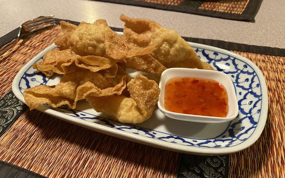 The chicken wonton appetizer at the Sai Nam Thai restaurant in Freihung, Germany, Dec. 6, 2022. They come with a sweet and sour dipping sauce. 