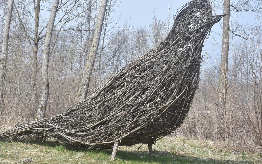 It's easy to hear the cries of birds while walking along the "naturalistic oasis" along the shores of Lago Santa Croce in Italy. But it's much harder to see one, with this large sculpture made of branches the notable exception.