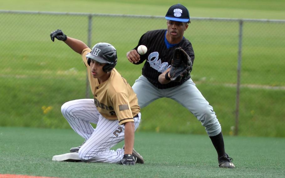 Humphreys' Ceser Celis slides safely into second base ahead of the throw to Cougars shortstop Jaylon Grant for his third stolen base of the game.