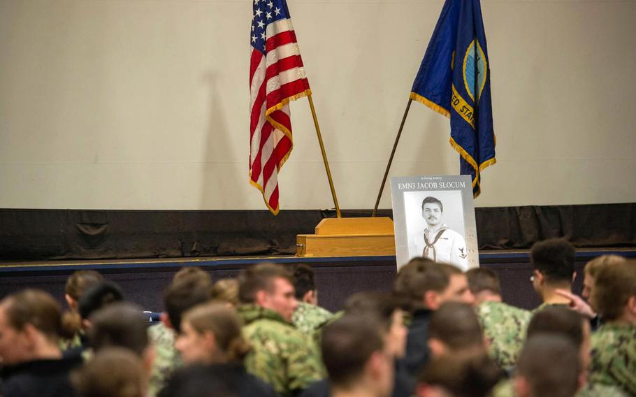 Sailors aboard the aircraft carrier USS Theodore Roosevelt gather Jan. 24, 2023, to remember Petty Officer 3rd Class Jacob Slocum. 