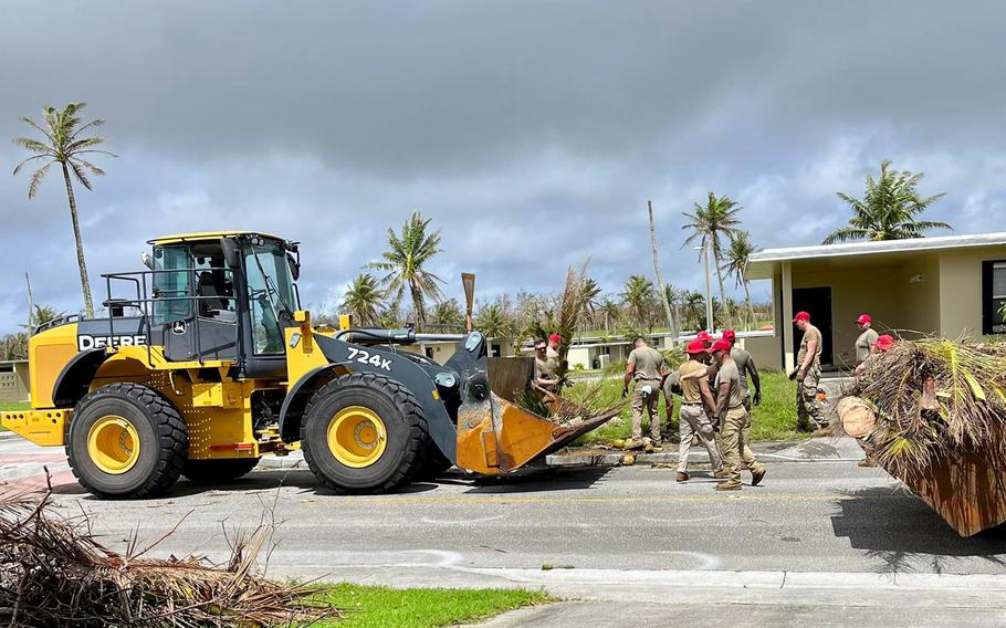 Airmen with the 554th Red Horse Squadron clear storm debris from a housing area at Andersen Air Force Base, Guam, Friday, June 2, 2023.