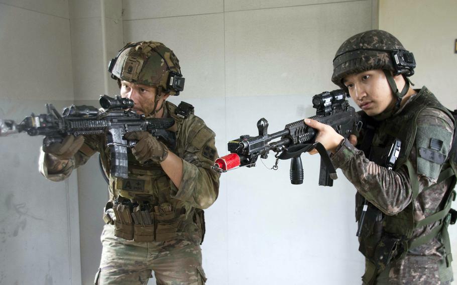 U.S. and South Korean soldiers breach a room filled with insurgents during urban combat training in Paju, South Korea, about eight miles from the North Korean border, Wednesday, Aug. 23, 2023. 