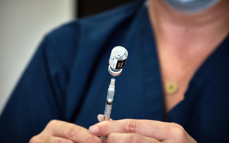 A syringe is filled with the Pfizer COVID-19 vaccine made for children ages 5 through 11 at Yokosuka Naval Base, Japan, Tuesday, Nov. 16, 2021. 