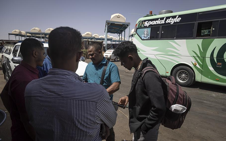 Sudanese nationals fleeing the fighting at home reach a bus stop near Aswan, Egypt, on April 27, 2023.