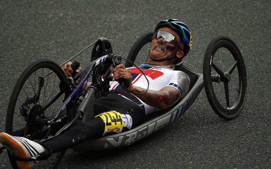 Paralympic cycler William Groulx, a Navy veteran, came off the circuit with some nasty abrasions after crashing at Fuji International Speedway outside Tokyo, Tuesday, Aug. 31, 2021. 