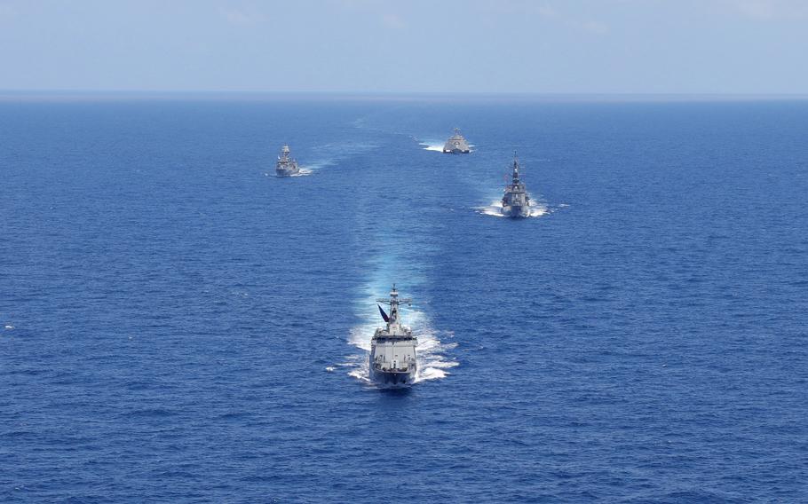 The U.S., Australia, Japan and the Philippines train in the South China Sea, within the Philippines' exclusive economic zone, Sunday, April 7, 2024.