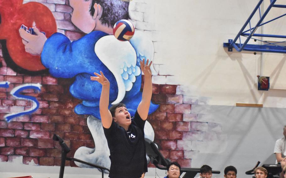 Black Forest Academy’s Joey Ebenroth sets the ball up for a teammate Saturday, Oct. 29, 2022, in the championship game of the DODEA-Europe boys volleyball tournament at Aviano Air Base, Italy.