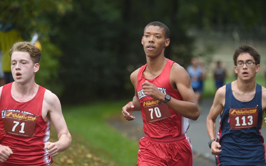 Kaiserslautern runner Jonathan Ramsey, center, runs alongside teammate Jacob Porter, followed by Aviano runner Zachary Taylor during the boys 3.1-mile cross country race at Vilseck, Germany, Saturday, Sept. 10, 2022.