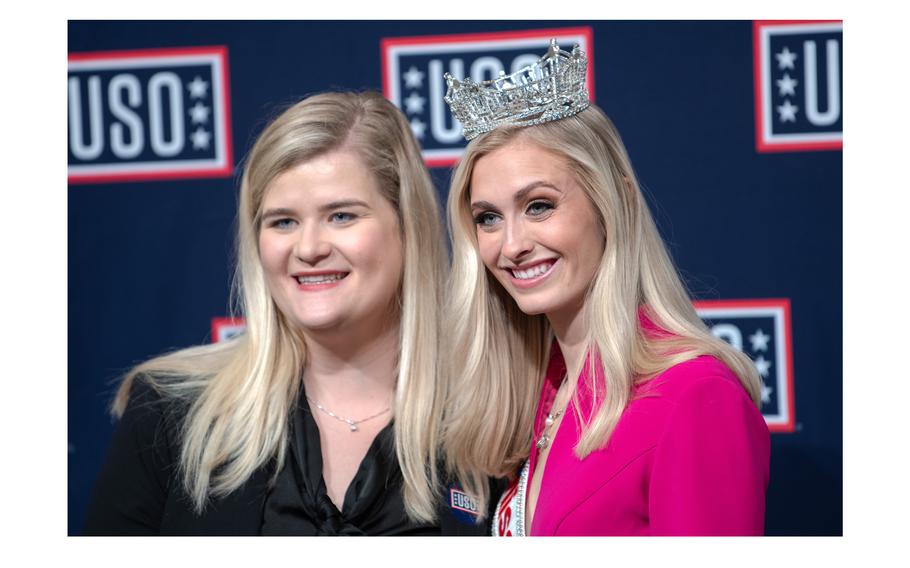 Miss America Madison Marsh, also a second lieutenant in the Air Force, smiles for a photo-op with an admirer at the House Cannon office building in Washington, D.C., on Tuesday, Feb. 6, 2024.