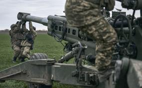 Ukrainian soldiers prepare a U.S.-supplied M777 howitzer to fire at Russian positions in Kherson region, Ukraine, Jan. 9, 2023. A rapidly expanding group of U.S. and allied troops and contractors are using phones and tablets to communicate in encrypted chat rooms to provide real-time maintenance advice to Ukrainian troops on the battlefield. As the U.S. and other allies provide a growing number of increasingly complex and high-tech weapons, the maintenance demands are expanding.