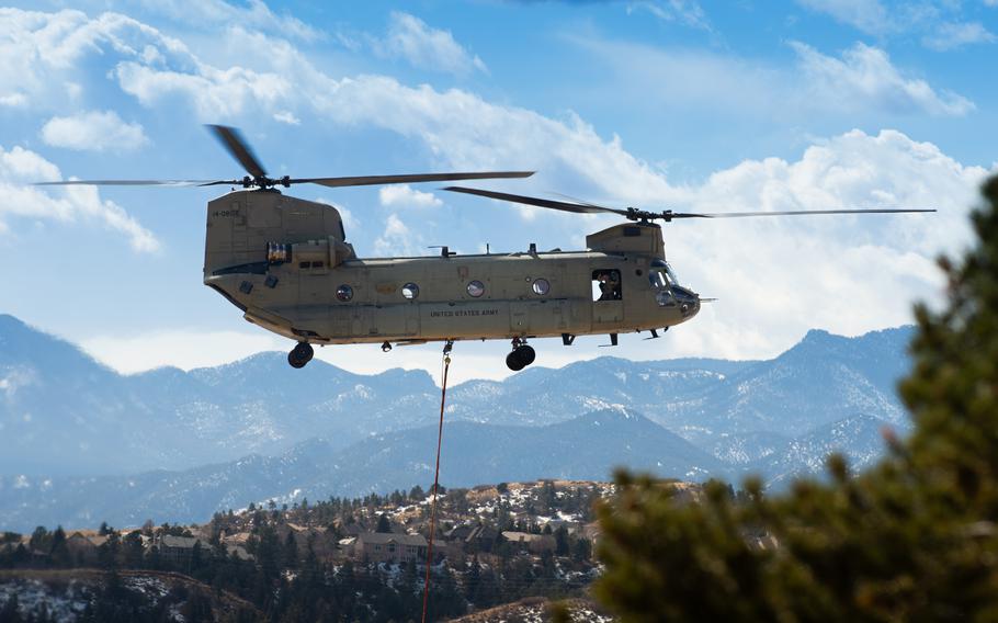 Firefighters from the U.S. Air Force Academy, Fort Carson and the Colorado Springs Fire Department dump water from air assets in their fight against the West Monument Creek Fire at the U.S. Air Force Academy on Feb. 26, 2024. 