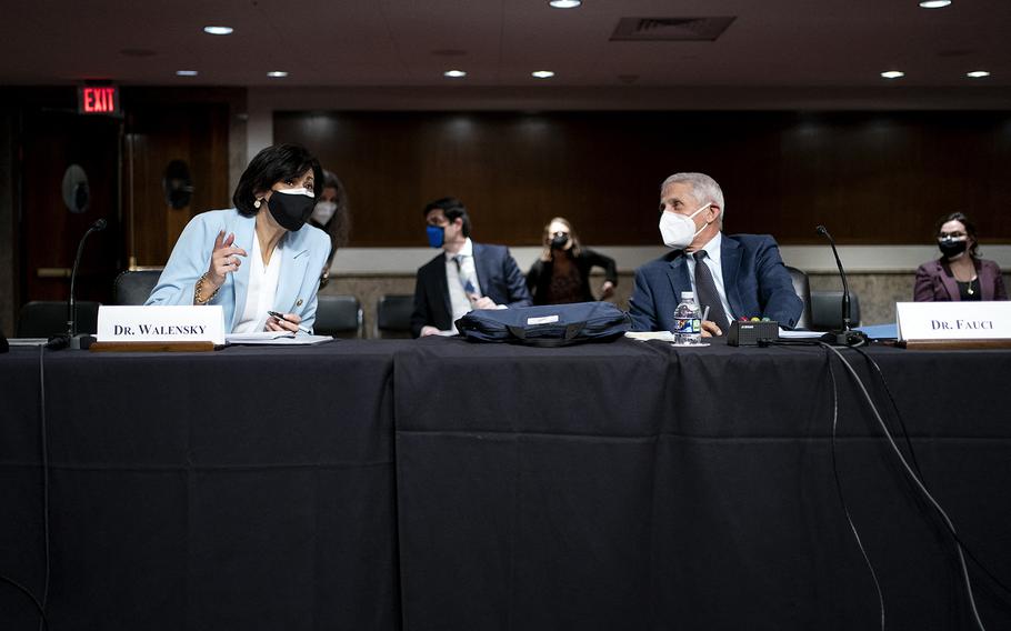 Dr. Rochelle Walensky, left, director of the Centers for Disease Control and Prevention, speaks to Dr. Anthony Fauci, White House chief medical adviser and director of the NIAID, before a Senate hearing on Jan. 11, 2022, on Capitol Hill in Washington, D.C.