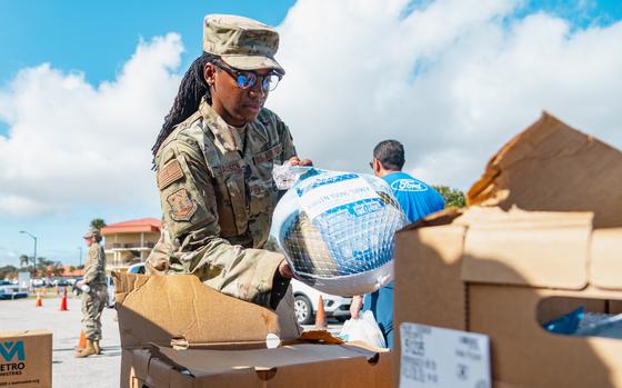 U.S. Air Force Master Sgt. Sarabrian Jackson, 6th Maintenance Group quality assurance chief inspector, unloads turkeys during a Nourish the Service event at MacDill Air Force Base, Florida, Nov. 17, 2023. Nourish the Service is a Blue Star Families supported annual event dedicated to bringing installation personnel donations during the holiday season. This year, the event provided free turkeys, vegetables, books and handwritten cards. Over the course of six hours, more than 275 service members and 75 volunteers attended the event. (U.S. Air Force photo by Airman 1st Class Zachary Foster)