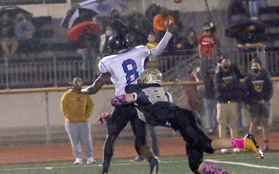 Osan quarterback Gavin Lunn gets away a pass as he's hit by Humphreys Gold's Lucas Bochat.