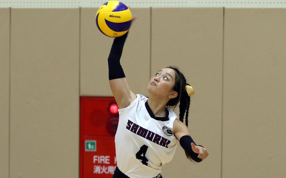 Matthew C. Perry's Towa Albsmeyer lets fly with a spike during Saturday's Japan girls volleyball matches. The Samurai split two matches with Fukuoka International and lost to E.J. King over the weekend.