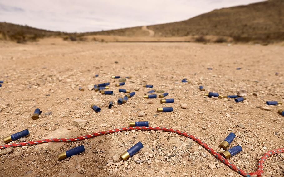 Used shotgun shell casings lie in the gravel at a public range in Sierra Blanca, Texas, March 22, 2023.