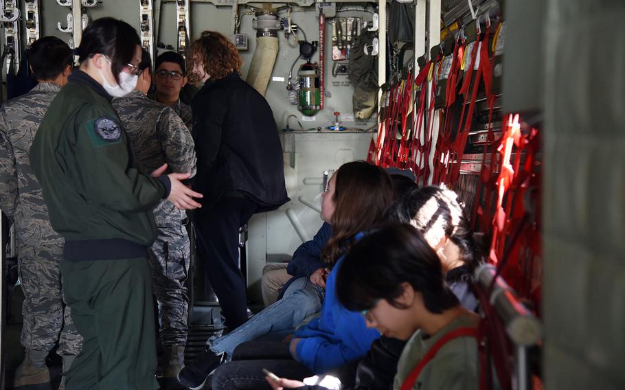 Students get a hands-on lesson on a C-130 airlifter during the second-annual Fly Girls event at Yokota Air Base, Japan, Wednesday, March 8, 2023.
