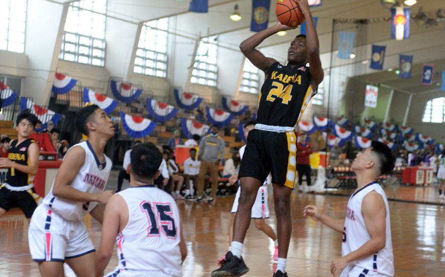 Kadena's Javontay Vickers goes up for a shot against Maehara during Saturday's pool-play game in the 16th Okinawa-American Friendship Basketball Tournament at the Camp Foster Field House. The Fighting Bulls edged the Panthers 68-66.