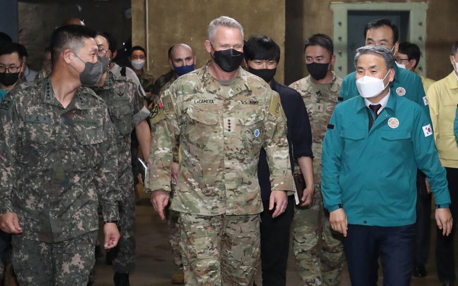 U.S. Forces Korea commander Gen. Paul LaCamera, center, talks with South Korean Defense Minister Lee Jong-sup, right, during the 11-day Ulchi Freedom Shield exercise at Command Post Tango in Seongnam, South Korea, Aug. 23, 2022.