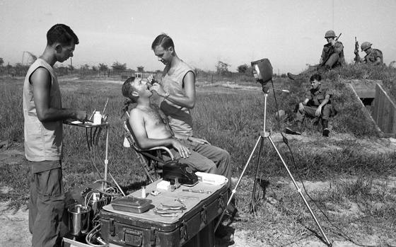 Di An Base, Vietnam, Oct. 14, 1968:  An 1st Infantry Division soldier opens wide for his dental treatment on Di An base. Three times a month Capt. and Dr. Earle Yeamans, the Big Red One's travelling dentist, and his assistant Spec. 5 Richard Ackley, hoist their 600-pound portable dentist's office aboard a helicopter and head for the boonies to pull teeth, fill cavities and give the infantrymen lessons on how to properly brush their teeth.

Check out the 1968 article on the Big Red One's travelling dentist and see more photos here. 

Looking for Stars and Stripes’ coverage of the Vietnam War? Subscribe to Stars and Stripes’ historic newspaper archive! We have digitized our 1948-1999 European and Pacific editions, as well as several of our WWII editions and made them available online through https://starsandstripes.newspaperarchive.com/

META TAGS: Pacific; Vietnam War; military medical; military life; combat; dentist; dentistry; oral health; dental care; health care; U.S. Army; 1st Infantry Division; Big Red One; 