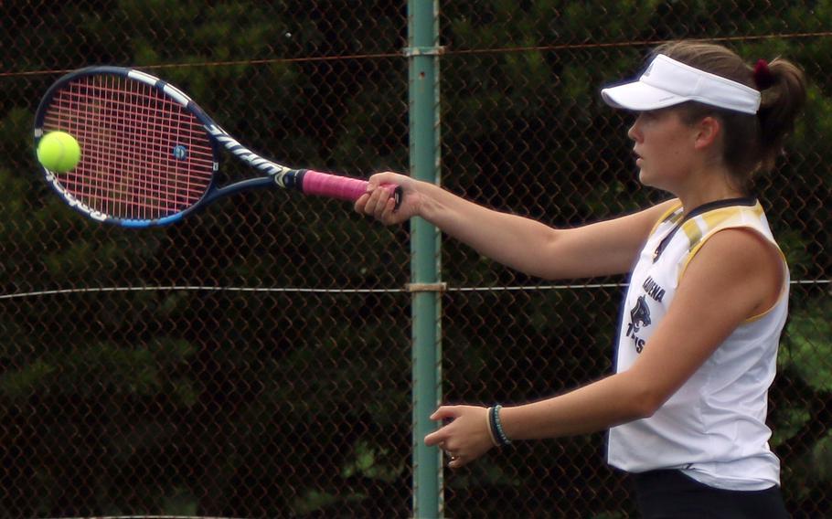 Kadena's Mary Tracy smacks a forehand return during Thursday's Okinawa tennis matches. Tracy teamed with Nathan Asato to beat Kubasaki's Owen Ruksc and Lan Legros 8-2 in mixed doubles.