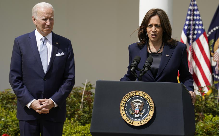 U.S. President Joe Biden listens to Vice President Kamala Harris as she delivers remarks on the Ghost Guns Rule in the Rose Garden at the White House in Washington, D.C., on Monday, April 11, 2022.