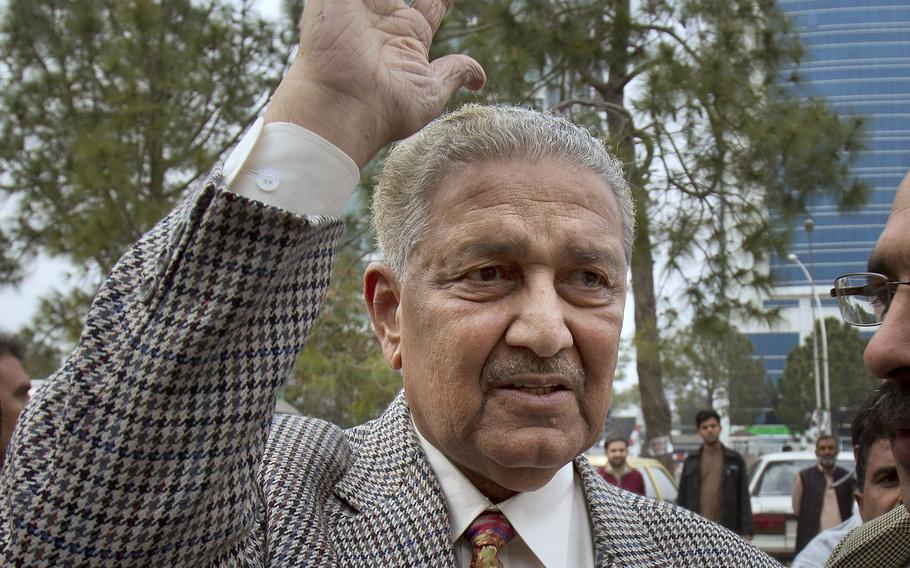 In this Feb. 26, 2013, file photo, Pakistan's nuclear scientist Abdul Qadeer Khan waves to supporters in Islamabad, Pakistan. Known as the father of Pakistan's nuclear bomb, Khan, died Sunday, Oct. 10, 2021 following a lengthy illness. He was 85.