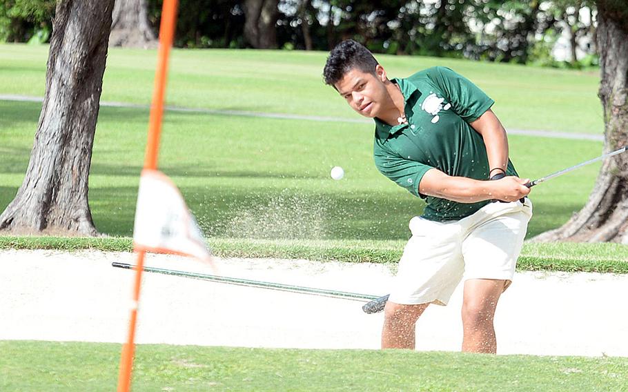 Kubasaki's Daniel Contreras blasts out of a bunker on the 155-yard, par-3 sixth hole at Banyan Tree Golf Course, Kadena Air Base, during Thursday's golf matches. Contreras finished second with 21 points using the modified Stableford scoring system.
