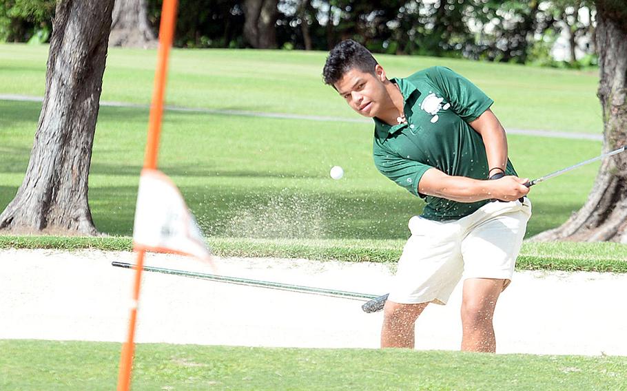 Kubasaki's Daniel Contreras blasts out of a bunker on the 155-yard, par-3 sixth hole at Banyan Tree Golf Course, Kadena Air Base, during Thursday's golf matches. Contreras finished second with 21 points using the modified Stableford scoring system.