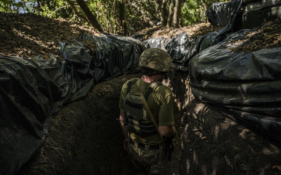A soldier, call sign Petrovich, stands in a trench on the Kherson frontline on August 8. Efforts by Ukrainian forces to recapture seized territory have slowed. 